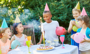 Happy kids celebrating a birthday party