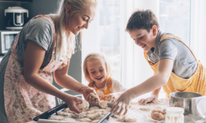 Mother baking with 2 children